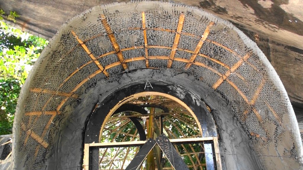 Cement render in process at the 3.5m bamboo and mesh dome building workshop